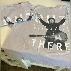 Two Paul McCartney concert t-shirts.